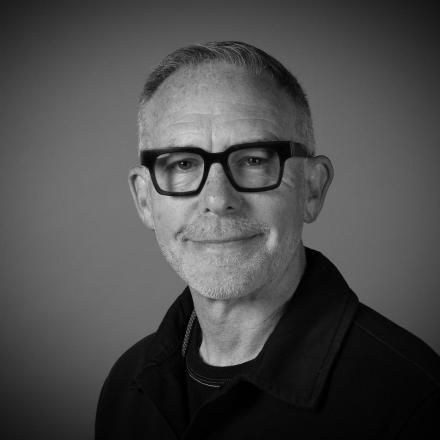 A black and white photograph of Chief Creative Officer Mike McGee